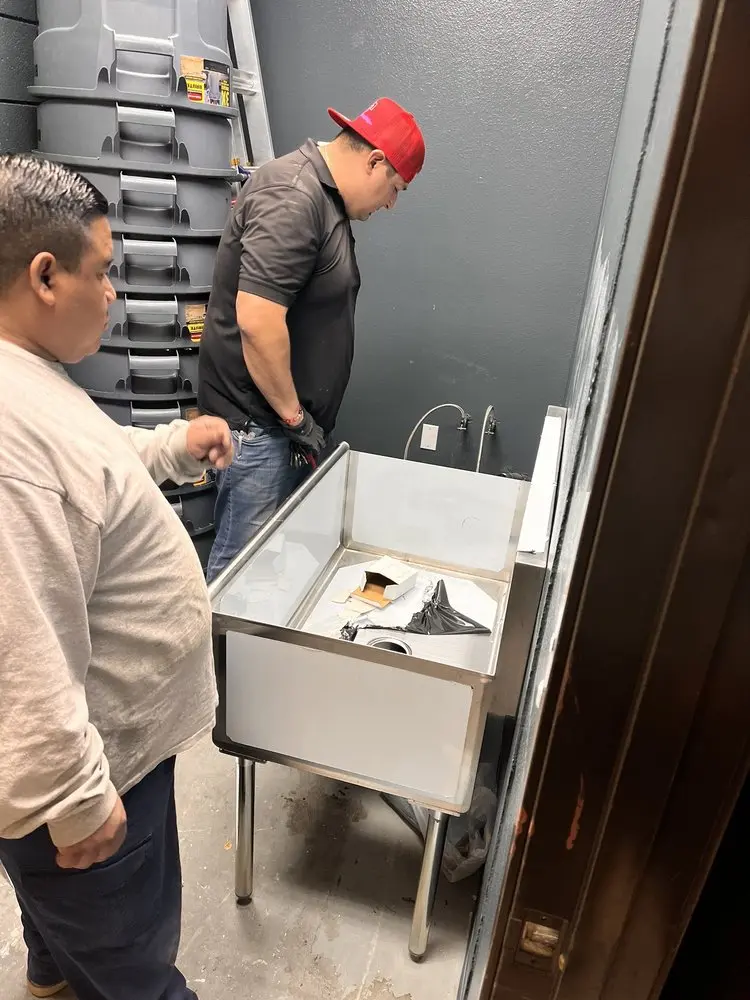 Commercial plumbing and sink installation in Groves